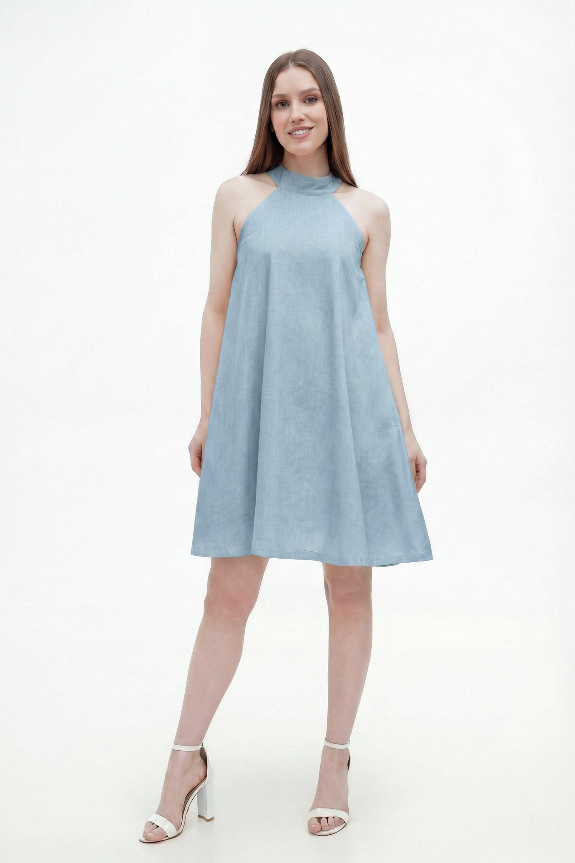 Woman wearing sky blue halter mini dress